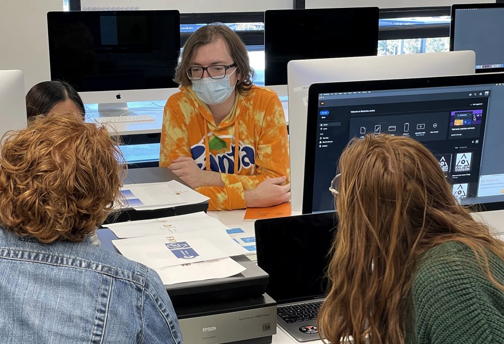 Four Students Providing Feedback to Each Other